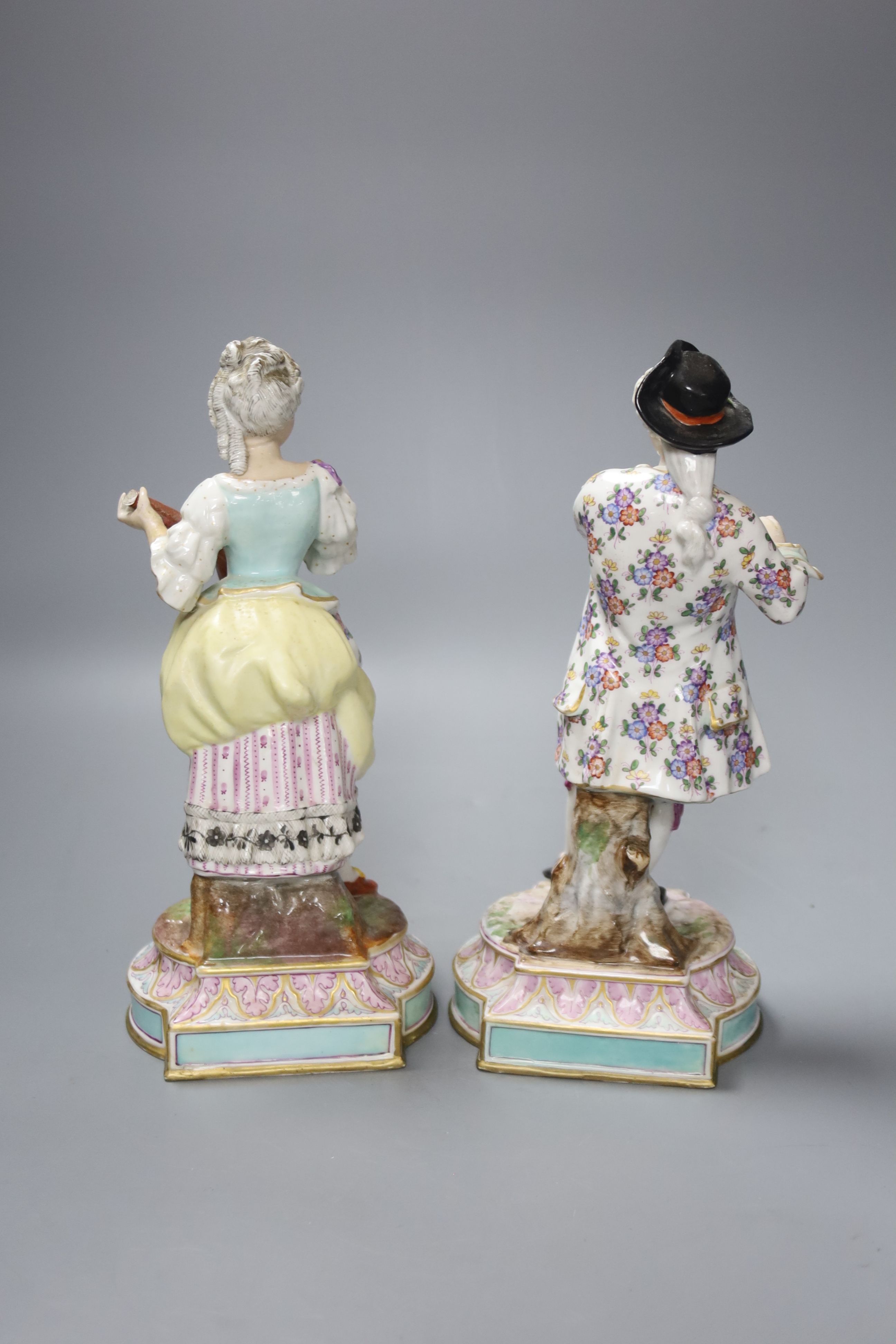 A pair of 19th century German porcelain figures, height 25cm